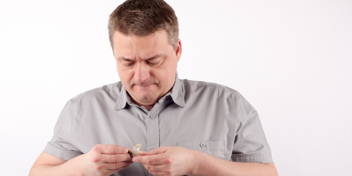 picture of man looking at his detroit hearing aids